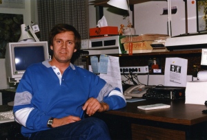 Author at his desk in the CBC Radio Newsroom in Edmonton. 