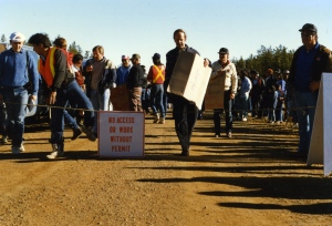 Herman Verbeek, Member of the European Parliament, carries a sign at the main checkpoint. 