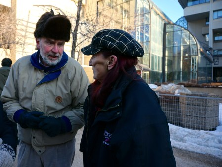 Former New Democrat MLA Jim Gurnett has words with Kyle Young's mother, Lorena, before the vigil began. [Photo by Author]