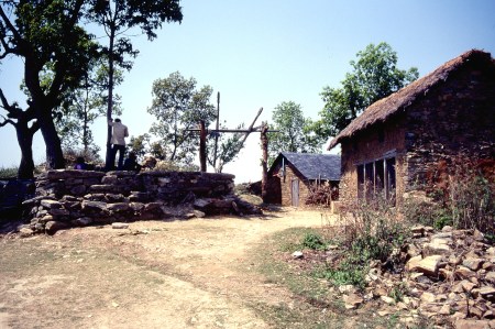 To the right is the school at Amp Pipal, where classes were taught by foreign missionaries who learned the Nepalese language.