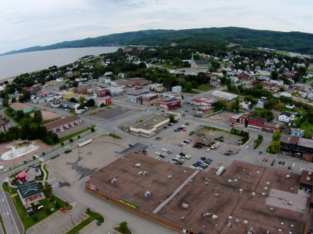 #12: Okay, no shopping centre roofs look exciting, I'll give you that. The Phantom rose 300 feet in the air to get this aerial of the east end of Campbellton. Hermini Thibeault of Campbellton assisted by keeping a close eye on the Phantom with his binoculars.