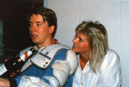 A weary Jari Kurri alongside his wife, Tiina. Tiina reported for the Helsinki Sanomat newspaper while the couple lived in Edmonton. Jari Kurri is the highest ranked non-Canadian for goals and points in the NHL. He became the first Finn to be inducted into the Hockey Hall of Fame. 