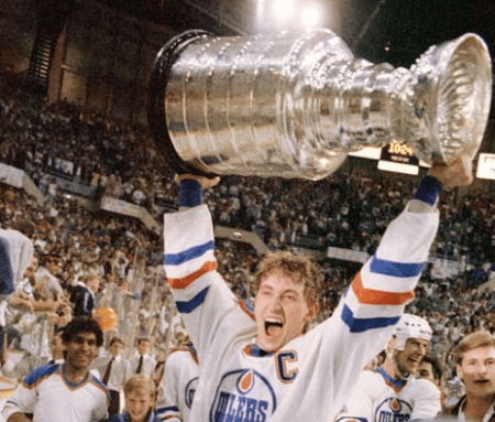 A jubilant Wayne Gretzky holds the Stanley Cup high. Photo courtesy of either the Edmonton Sun of the Edmonton Journal. I can't remember whose photographer snapped this great shot.