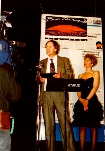 Accepting a 1991 reporting award from the Canadian Association of Journalists
