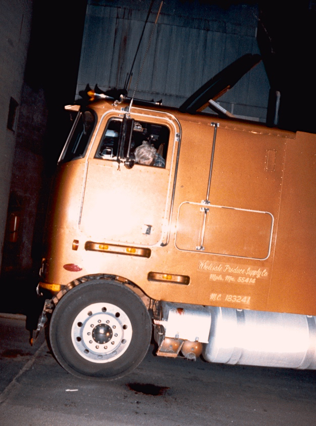 A burglary gone mad: the body of 47-year-old Gerry Thies in the cab of his transport truck. Thies died instantly. Click to enlarge.