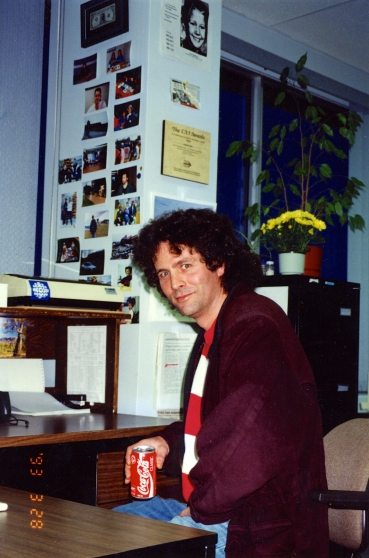 High on Coke: David Milgaard pays a visit to the CBC Radio Newsroom in Edmonton. He is sitting at my desk. Photo taken in March 1993.