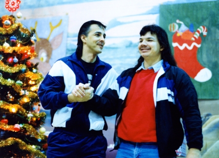 John Schimmens encourages a visitor during a Christmas social at the Edmonton Institution in 1992.
