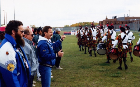 One of the socials organized in part by John Schimmens. The wail of bagpipers arriving in the prison's exercise yard gave the prisoners a lift. Notice one con [Ken] pumping his fist in the air.