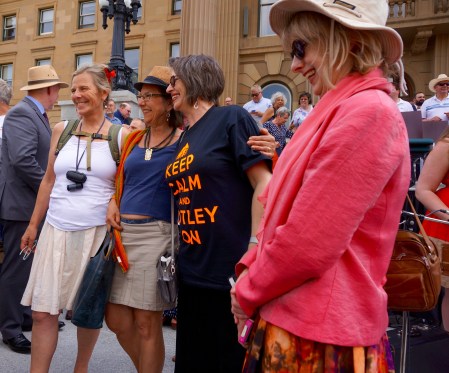 4 smiling women steps