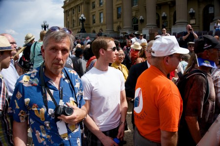 The man with the blue shirt seems to be saying,