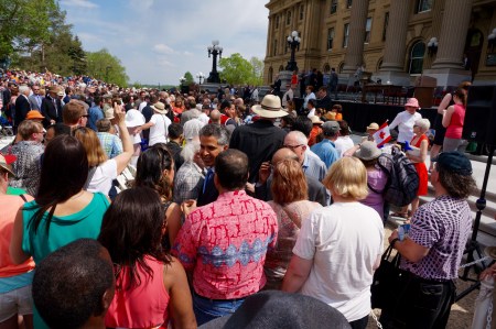 Alberta's new cabinet leaves the steps of the Legislature to greet people in the crowd.