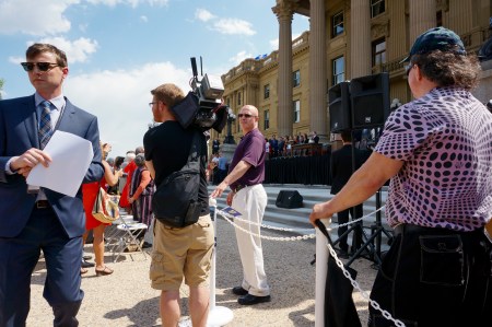 NDP media handler and [to the right] the push-up man. More on him later.