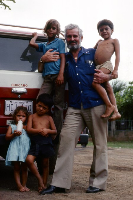 Peter Tacon with some children he met on a side street. These kids were not in care. The photo was used by the Canadian Press in a wire story that was picked up by many newspapers, including the Toronto Star.